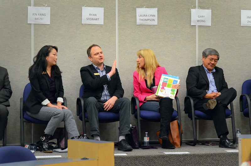 From left, trustee candidates Jen Yang Mezei, Ryan Stewart, Laura-Lynn Tyler Thompson and Gary Wong disagree on SOGI 1 2 3 at an all-candidates meeting at Byrne Creek Community School.