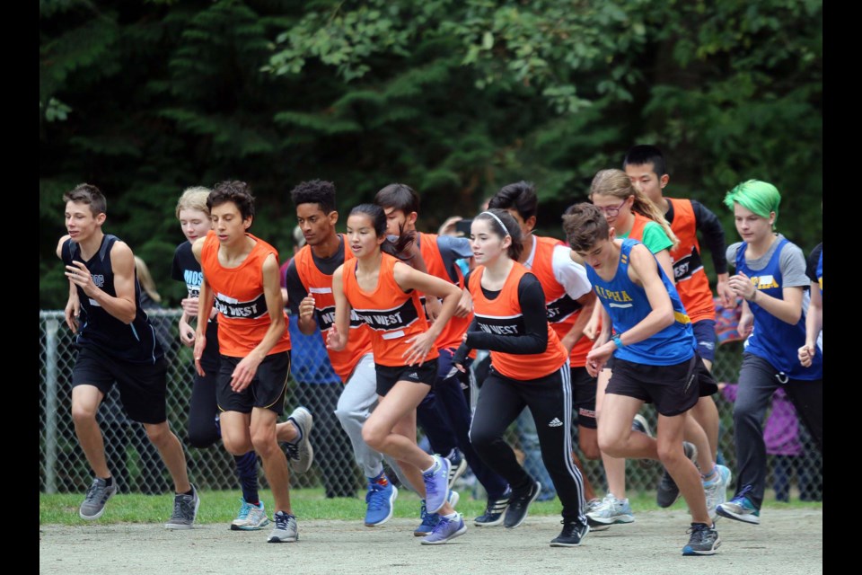 Runners from the Burnaby-New West district join Coquitlam districts runners at the second meet of the high school season on Wednesday.