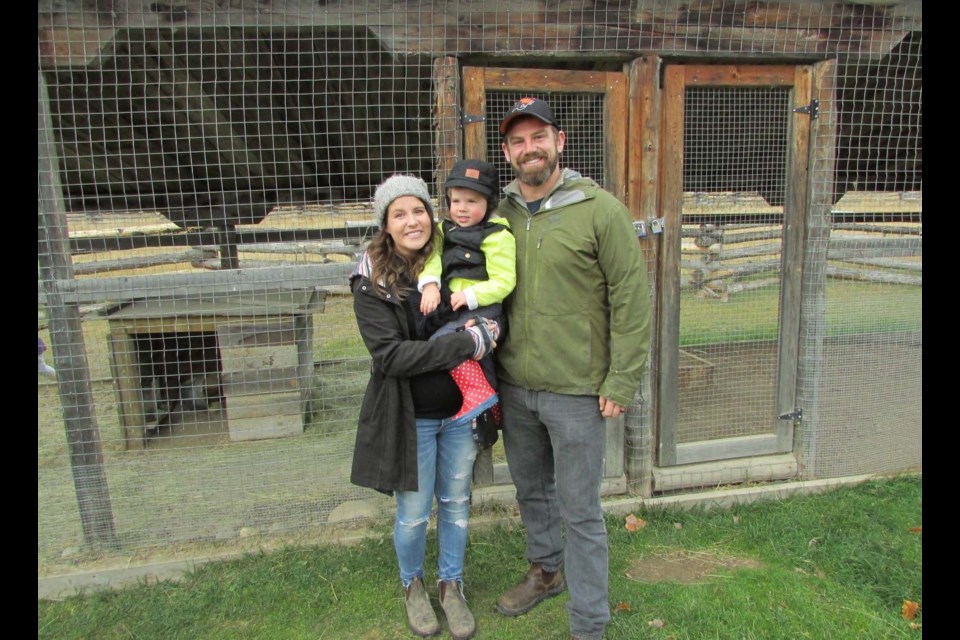 Melissa White, holding daughter two-and-a-half-year-old Finley, and Dylan, visited Huble Homestead for the first time Monday to enjoy the Thanksgiving event that saw many tradiitional games being played, hot lunches offered and bunnies to watch. Citizen photo by Christine Hinzmann