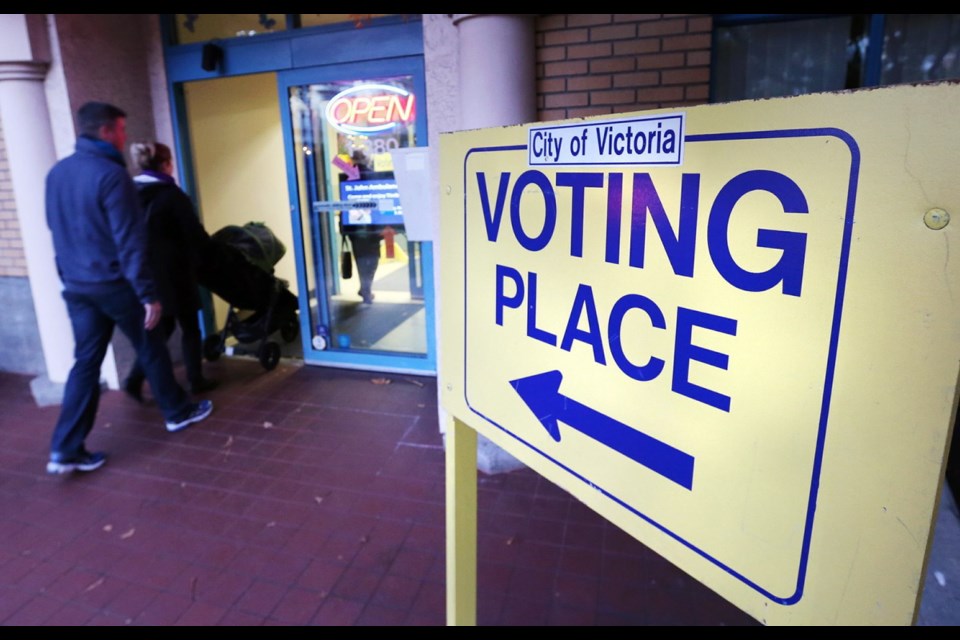People arrive at the Cook Street Village Activity Centre in 2014 to vote in the Victoria municipal election. A byelection will be held on Dec. 12, 2020.