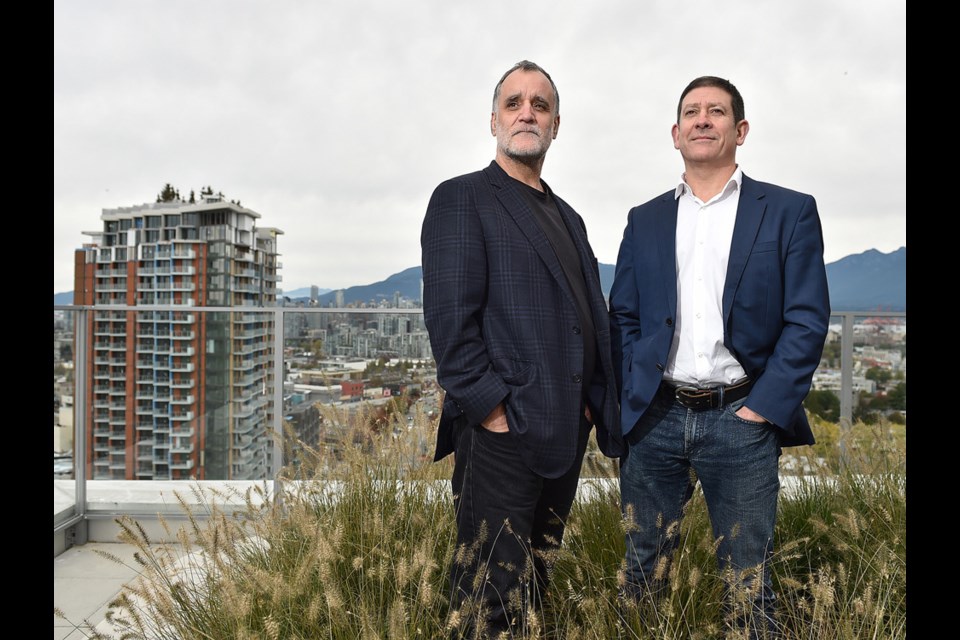 Russell Acton and Mark Ostry, principals of Acton Ostry Architects, on the rooftop of The Duke, a rental building their firm designed at 333 East 11th Ave. Photo Dan Toulgoet