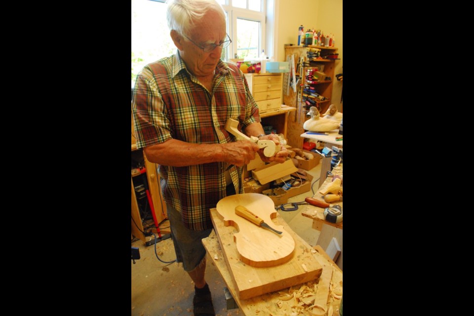 Bob working on a violin.