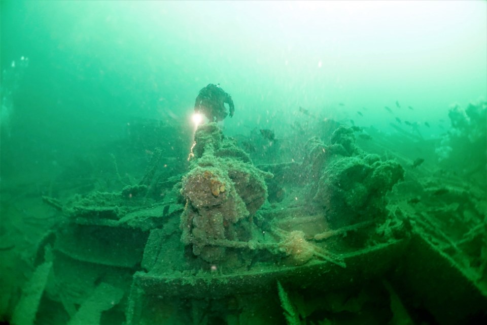 Jacques Marc swims over the stern winches on the wreck of the SS Princess Sophia.