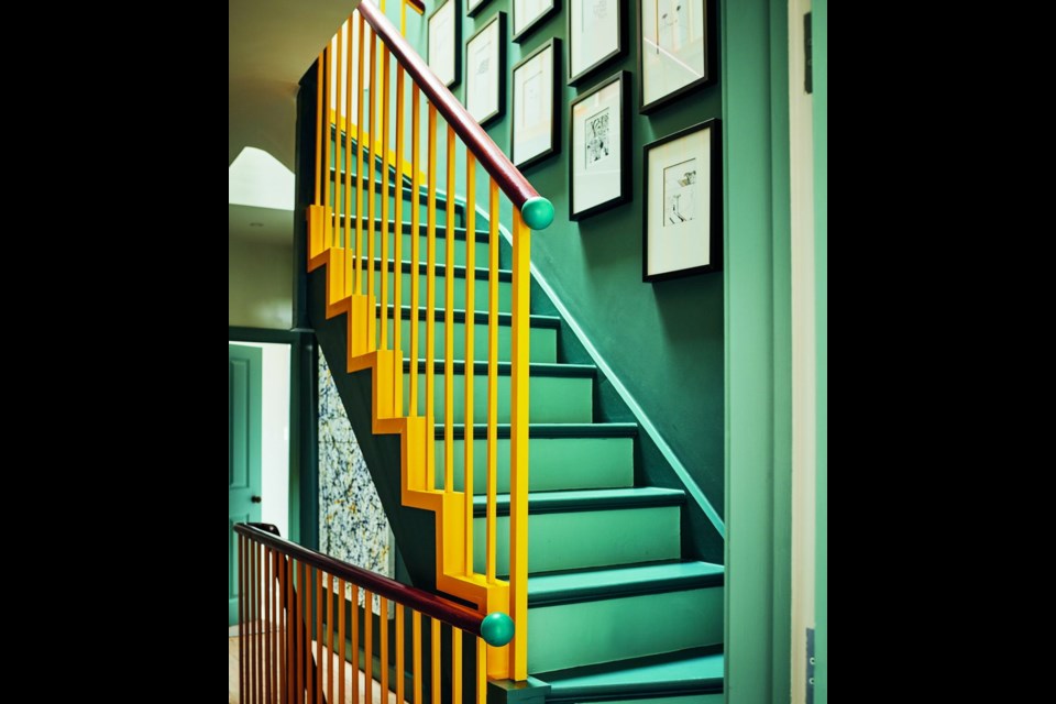 Yellow accents on the staircase link to the rooms on both floors.