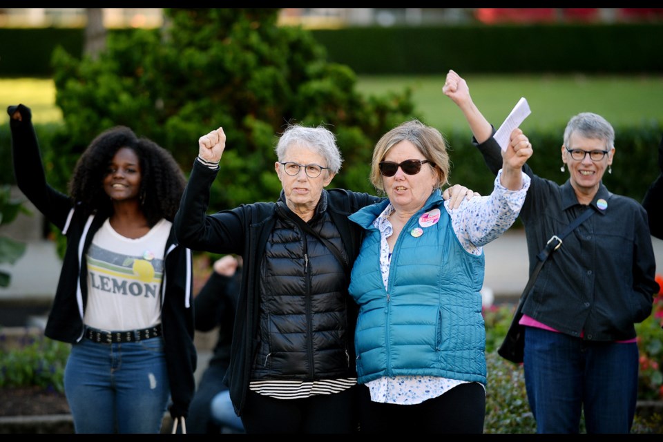 Burnaby teacher Donna Morgan (right) and her wife Jeanne Boucher at a rally in favour of SOGI school policies.