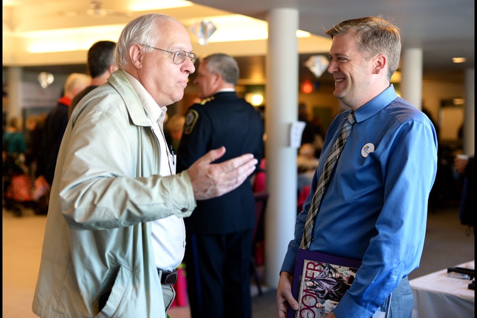 John Davies, president of the New Westminster Symphony Orchestra, chats with Mayor Jonathan Cote.