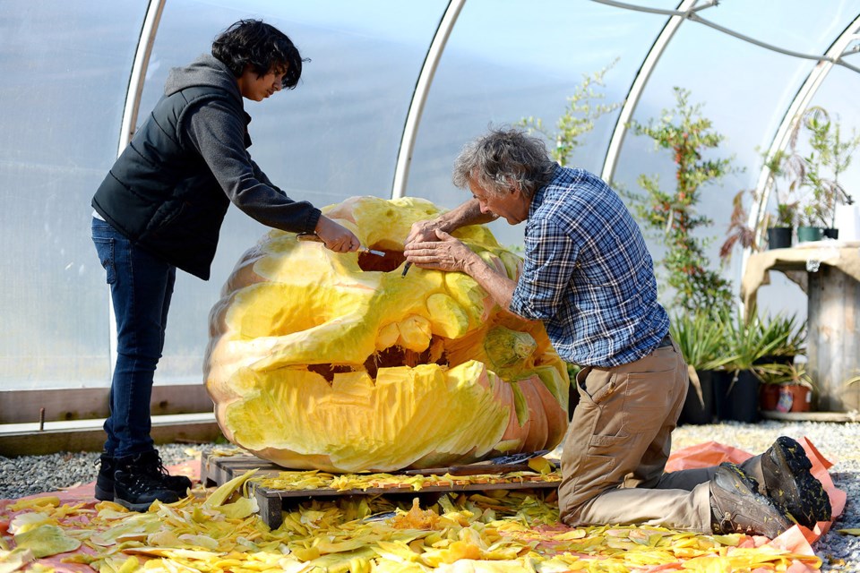 The Harvest Day Party at It's About Thyme Nursery featured pumpkin carving by George Rammell, with some help from Azaan Dossa.