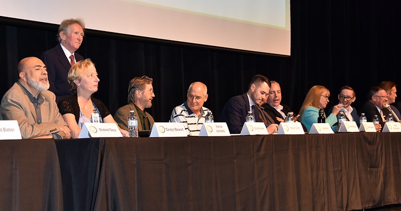 Port Coquitlam mayoral and council candidates including (standing) Patrick Alambets, who was ejected before the meeting started.