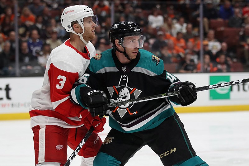 Ben Street of the Anaheim Ducks pushes off of Nick Jensen of the Detroit Red Wings during the third period of a game at Honda Center on October 8, 2018 in Anaheim, California.