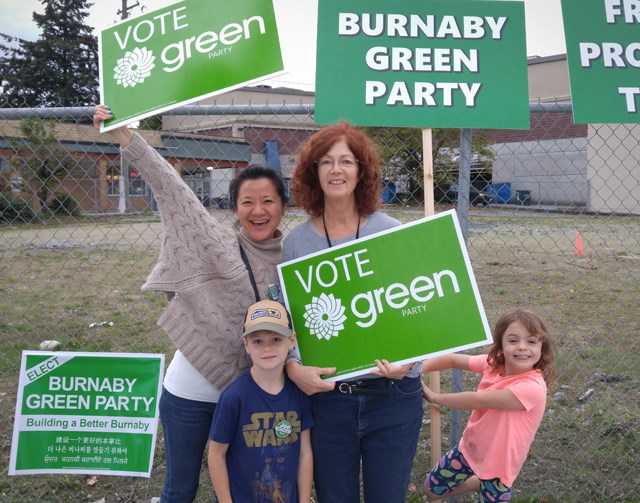 Burnaby Green Party trustee Christine Cunningham campaigns with her grandchildren, Oliver and India Shearing, and her friend Abby Ge.