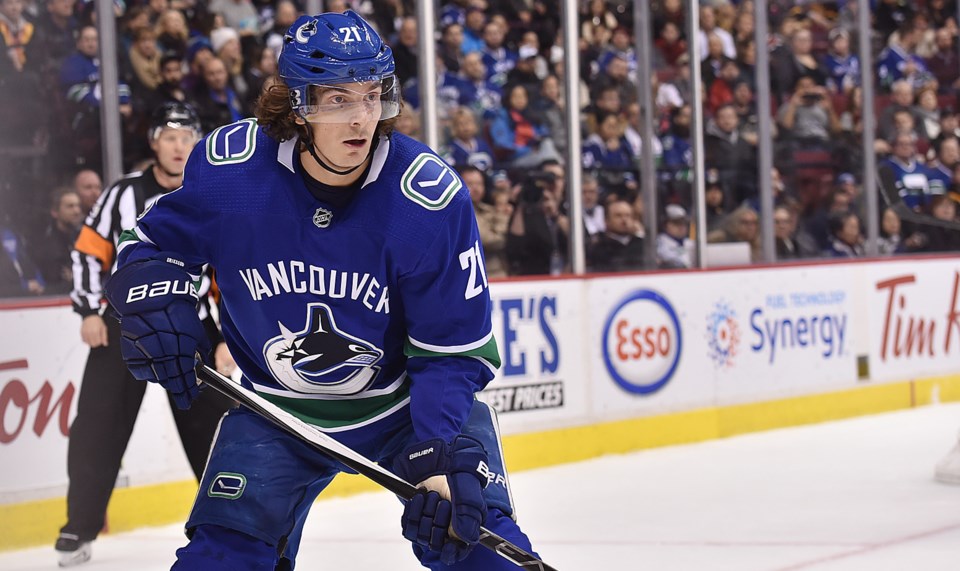Loui Eriksson looks for the puck in a game with the Vancouver Canucks