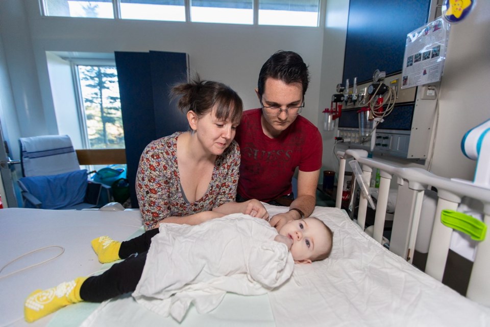 Gloria and Chris McDonald at Victoria General Hospital with their daughter, Olivia, who has a genetic condition so rare that only 30 other people worldwide have been diagnosed with it. Olivia is considered a pediatric palliative-care patient.