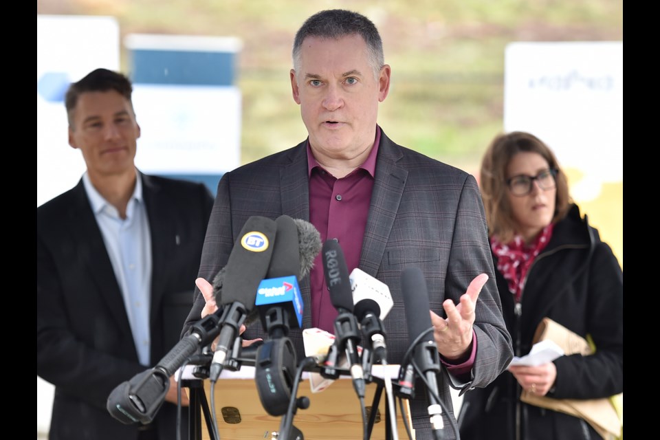 Thom Armstrong, executive director of Co-op Housing Federation of BC and the Community Land Trust — the federation's non-profit real estate arm— stressed the importance of partnerships when it comes to creating affordable housing. He was joined by Mayor Gregor Robertson and Tiffany Duzita, director of development for the Community Land Trust, to announced the groundbreaking for the final phase of Fraserview Housing Co-op. Photo Dan Toulgoet