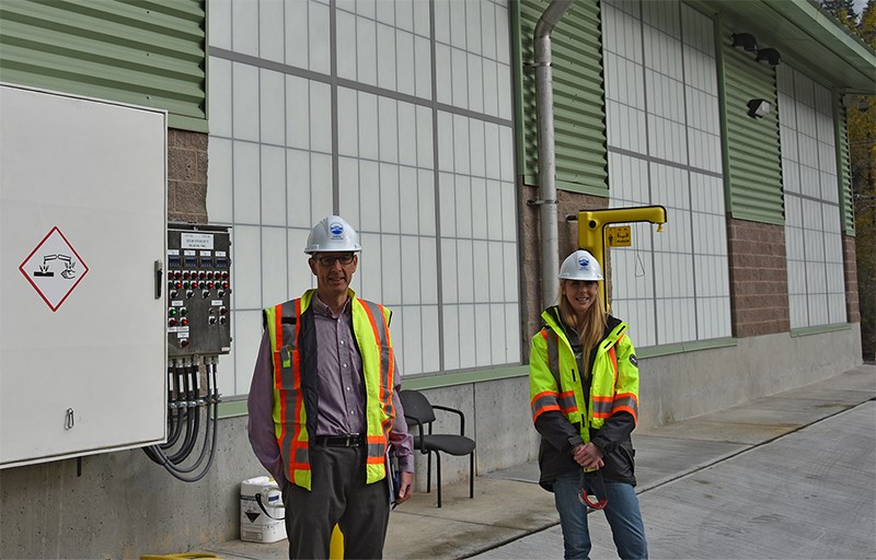 Tanya Ritchie, water treatment operator, and Andrew de Boer, division manager of water treatment for Metro Vancouver, check out the equipment in the new sodium hypochlorite system that was installed to replace the older chlorination disinfection system, a two-year project at the Coquitlam water plant that cost $4.3 million.
