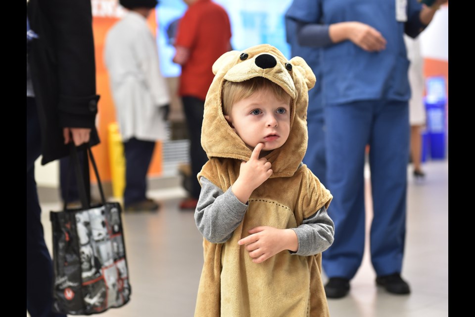 Two-year-old Cyrus Amies takes part in BC Children’s Hospitals trick-or-treat event. Photo Dan Toulgoet