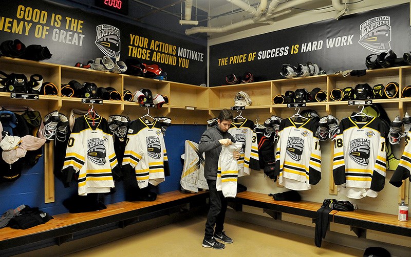 MARIO BARTEL/THE TRI-CITY NEWS
Coquitlam Express trainer Ross Maceluch lays out uniforms and equipment for the players before their arrival for Wednesday's midday game against the Langley Rivermen.