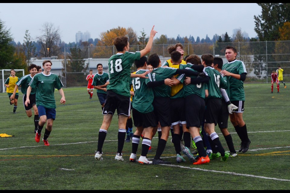 The Burnaby Mountain Lions celebrate after defeating Burnaby Central 3-2 in the league playoff final on Wednesday.