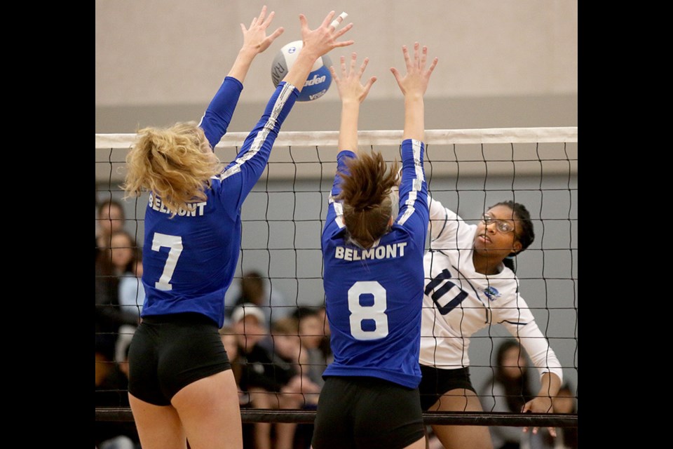 MARIO BARTEL/THE TRI-CITY NEWS
Riverside Rapids Anasha Thomas tries to smash the ball through Belmont Bulldogs defenders Jocelyn Sherman and Elise Gagnon, in the first set of their opening round game at the annual Red Serge Classic high school senior girls volleyball tournament, Friday at Riverside secondary in Port Coquitlam. Belmont, the top-ranked team in the province, went on to win the tournament, defeating Pacific Academy in Saturday's final. Riverside finished fourth after they lost the consolation final to Lord Tweedsmuir in two sets. The Rapids' Sophie Wong was named to the tournament's all-star team.