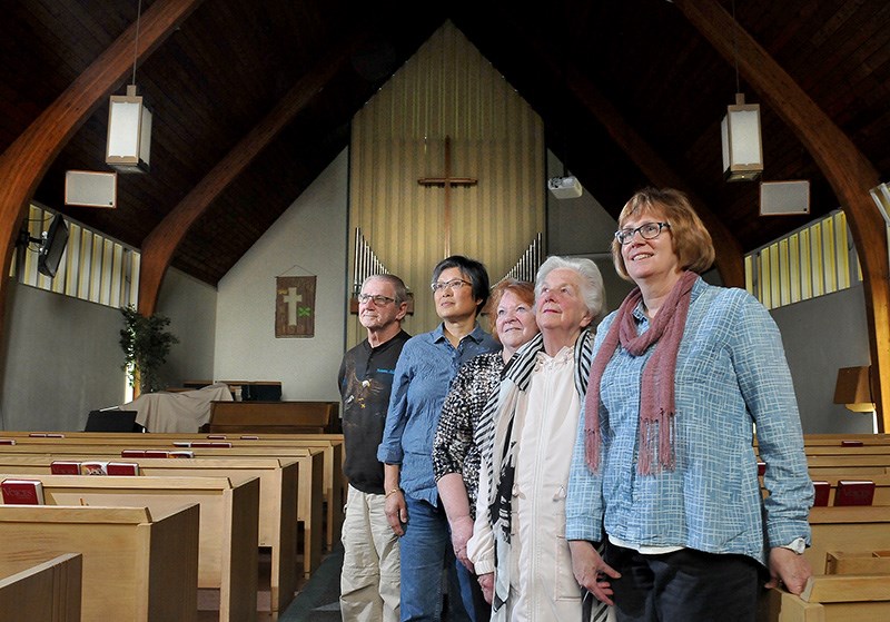 Members of the congregation at St. Andrews United church in Port Moody are preparing to say goodbye to the old building with a community celebration on Saturday. They include, (R-L) pastor Julie LeBrun, Valerie Julian, Diane deGroot, Julie Asselstine, and Peter deGroot. The church will be relocating to Port Coquitlam for two years while the property is redeveloped for affordbable housing, office space and a new 540 square-metre church facility.