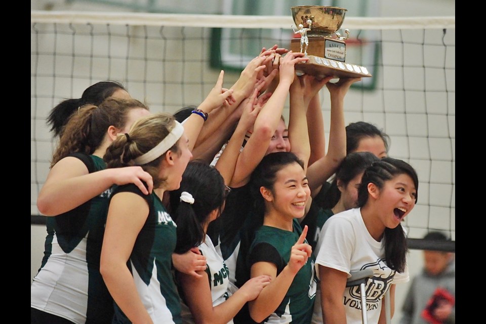 Rallying behind injured teammate Olivia Lin (front) the McRoberts Strikers repeated as Richmond Senior Girls Volleyball champions with a thrilling four-set win over the Steveston-London Sharks on Wednesday night.