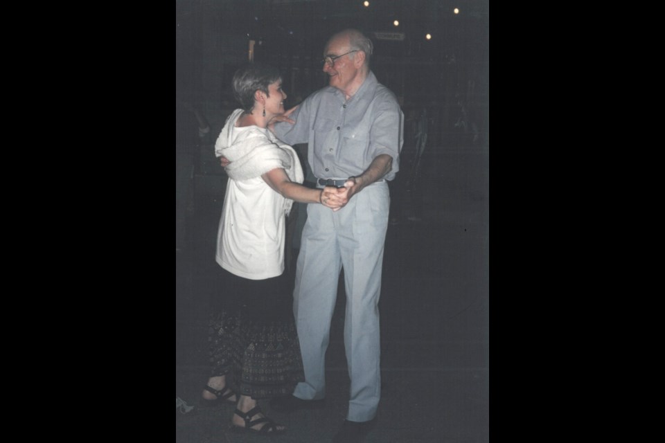 The author, Elaine Cameron, dancing with her father Stanley while on vacation in France.