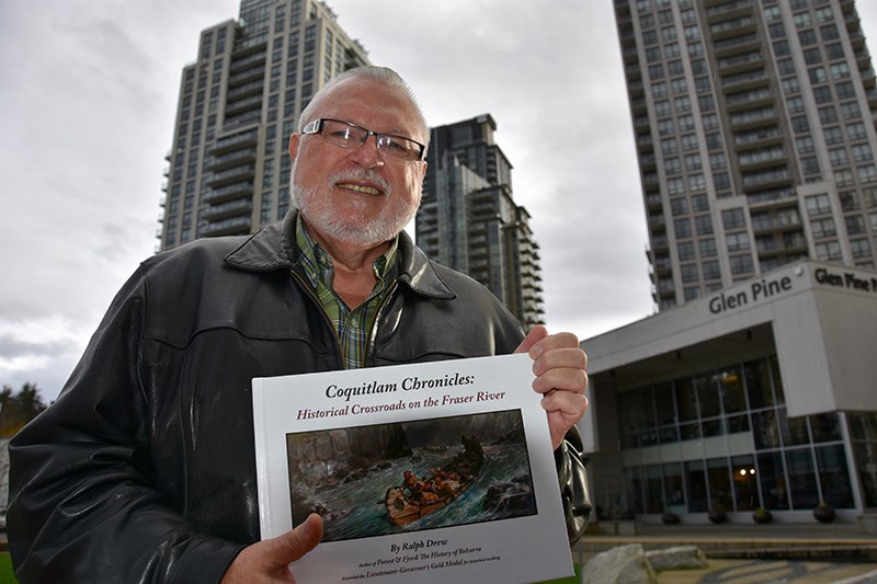 Ralph Drew, author of Coquitlam Chronicles detailing the history of the region, stands amongst the tall towers of the city’s centre where tall trees once stood.