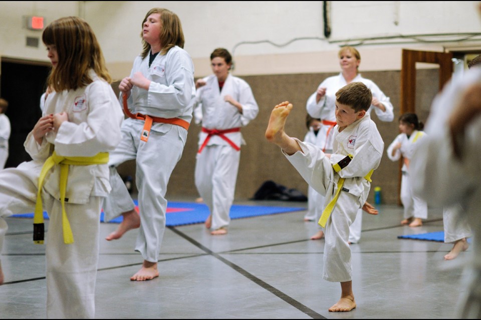 Eight-year-old Carsen Cound keeps his kicks high and quick during the Western Karate Academy’s 2016 kickathon.