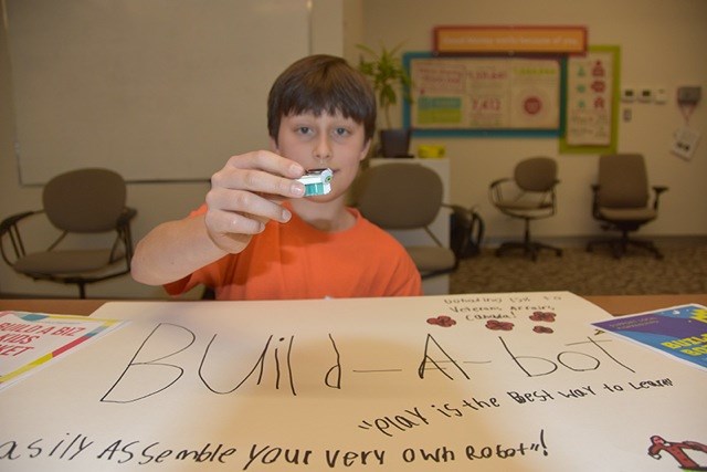 Alex Jankacky shows off his reindeer Christmas decoration bot that he’ll be promoting at the KidPreneurs Market Day on Nov. 24 at Henderson Place Mall.