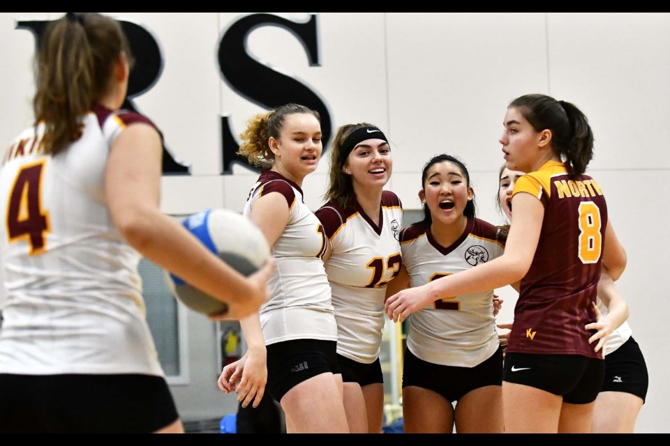 The Burnaby North Vikings’ Gianinna Masellis, Anna Linieski, Taylor Tucci, Audrey Tsung, Elisa Echelli and Olivia Coventry gather after a point in the third-place game during the Lower Mainland senior girls tournament last week.
