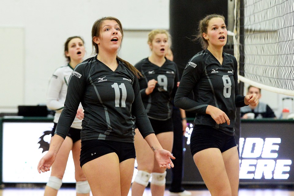 Douglas College's Olivia Cesaretti, at right, helped power the women's volleyball team to a pair of victories. She was named PacWest women's volleyball player of the week for her efforts.