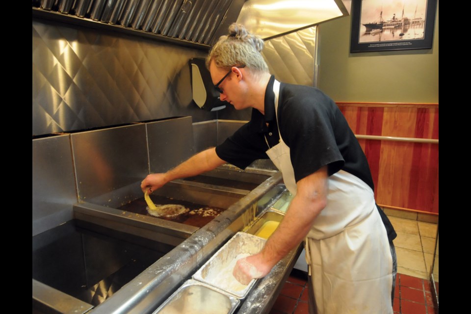 Cook John Loucks fries the fillet for a one-piece halibut dinner at C-Lovers.