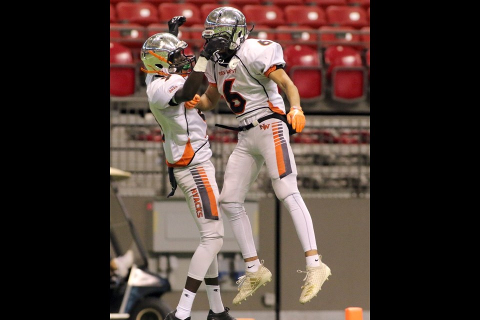 MARIO BARTEL/THE TRI-CITY NEWS New Westminster Hyacks wide receiver Matthew Lalim (#9) celebrates his touchdown with teammate Arjun Bal late in the team's 33-0 win over the Terry Fox Ravens in Saturday's BC Secondary Schools Football Association AAA Subway Bowl semi-final at BC Place Stadium.