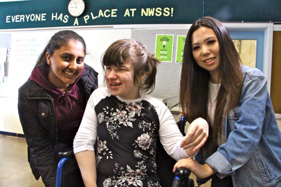 From left, Simran Grewal, Robyn Kennedy and Kate Choi are part of the New Westminster Secondary School Best Buddies club, which recently won a $5,000 grant from Shaw.