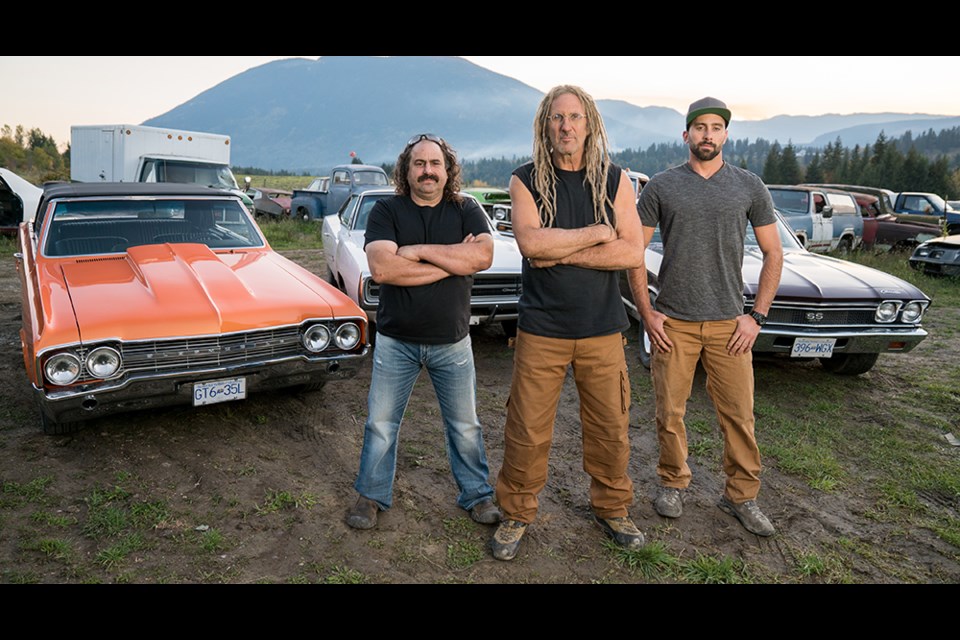 Avery Shoaf (from left), Mike Hall and Connor Hall are the stars of Rust Valley Restorers on History Channel. The car restoration reality show is filmed in Tappen, about an hour east of Kamloops. Hall has a 1960s convertible worth $68,000 up for grabs in the fall Habitat for Humanity Kamloops raffle. For information on when and where raffle tickets will be sold, call 250-314-6783.