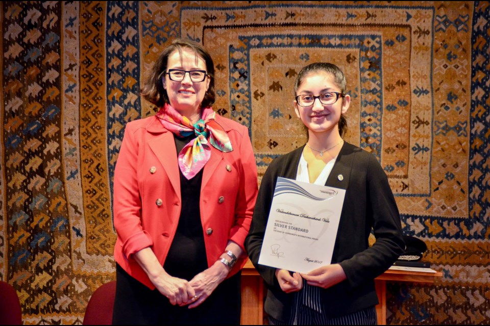 The Honourable Janet Austin, (left) Lt. Gov. of B.C. presented 39 youth with prestigious Silver Level Duke of Edinburgh Awards in Burnaby. Receiving one of the awards was Richmond’s Vedanshikumari Dasharathsinh Vala. Photo submitted