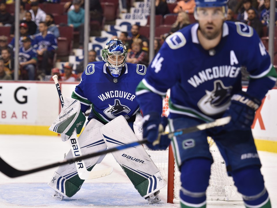 Mike DiPietro tends goal for the Vancouver Canucks during the 2018-19 preseason.