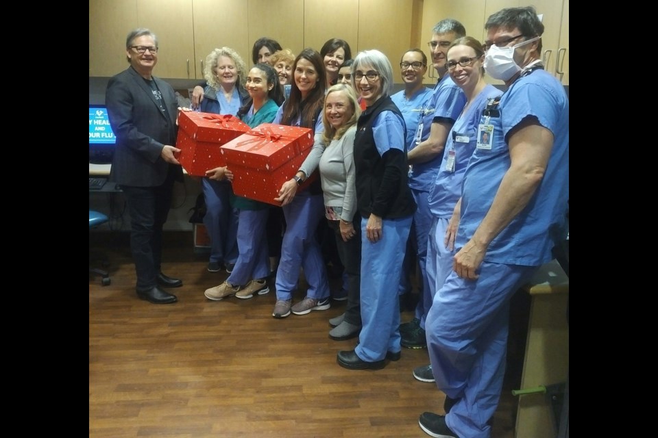 Coun. Chuck Puchmayr, far lef, visited Royal Columbian Hospital this week as part of Operation Popcorn.