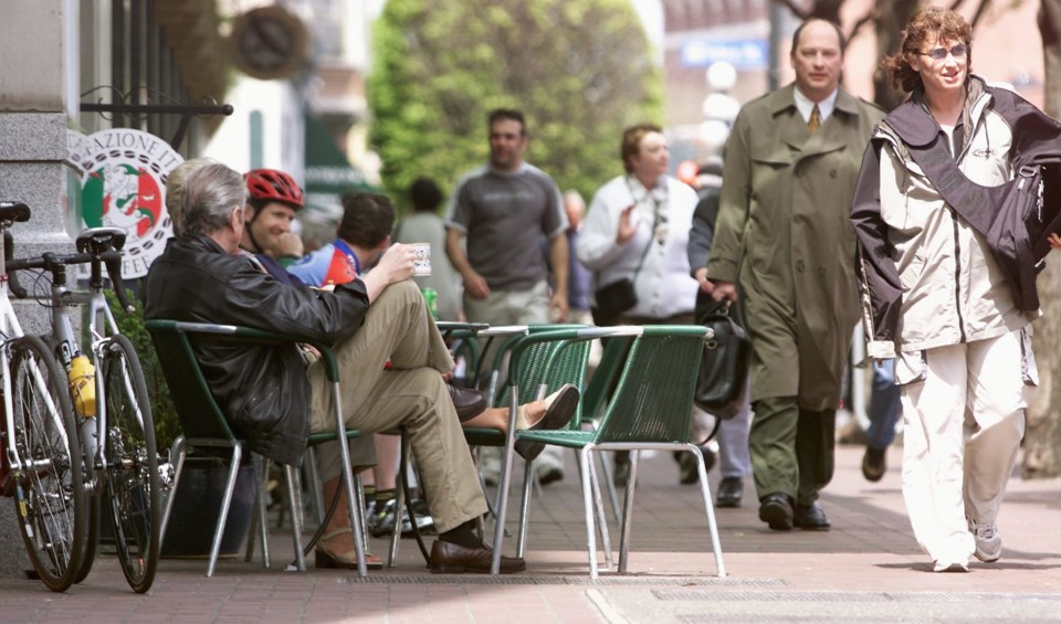 A café patio extends onto the sidewalk along Government Street.