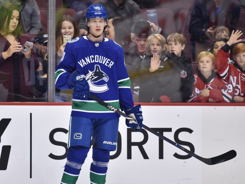 Elias Pettersson is admired by Canucks fans prior to a game.