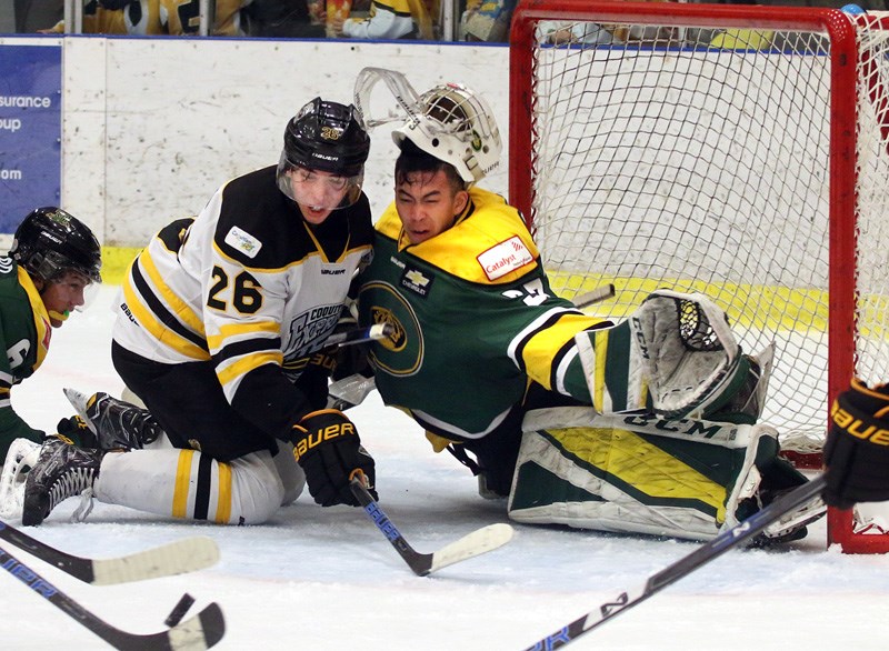 Power River Kings goalie Matteo Paler-Chow loses his mask as Coquitlam Express forward Henry Rybinski scrambles for a loose puck in the first period of their BC Hockey League game, Sunday at the Poirier Sports and Leisure Complex. Coquitlam won the game, 6-3.