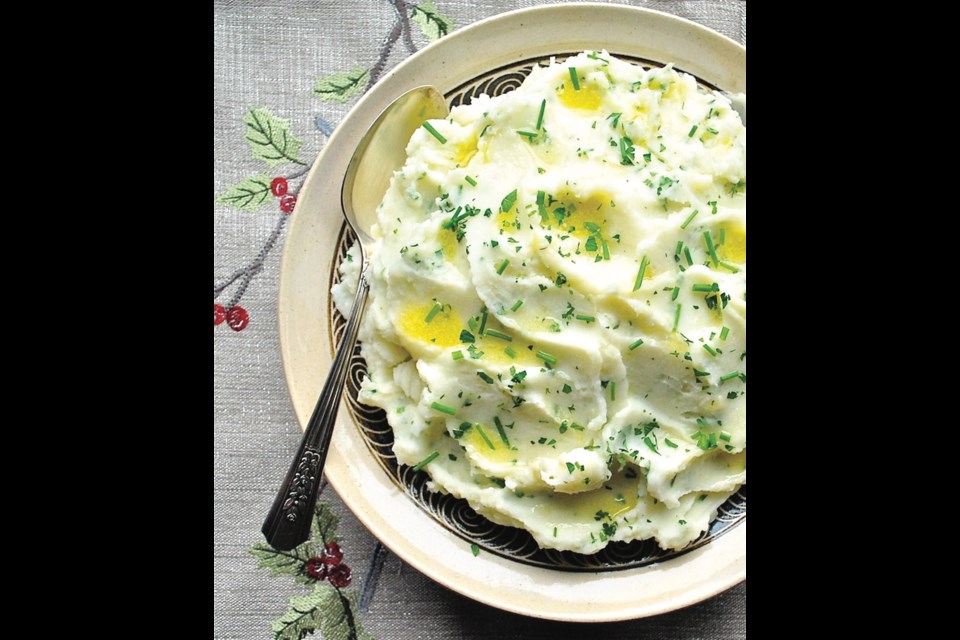 Light and tangy whipped potatoes are flavoured with garlic, parsley and chives.