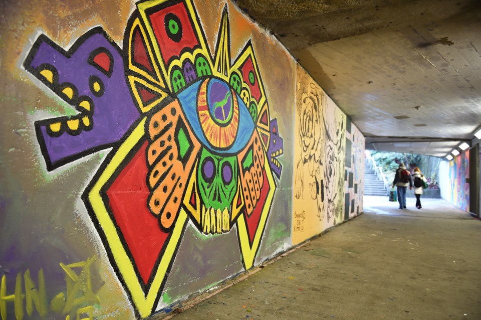 A dozen artists got the chance to have their murals decorate the walls of the pedestrian tunnel conn