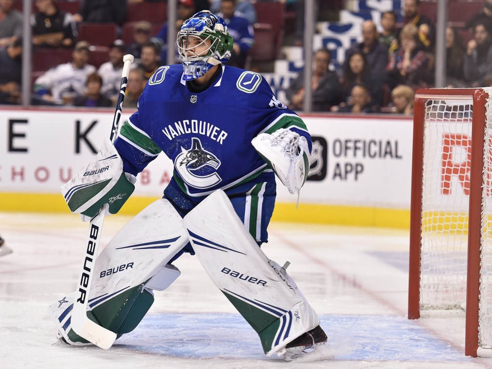 Mike DiPietro tracks the puck for Vancouver Canucks in 2018 preseason