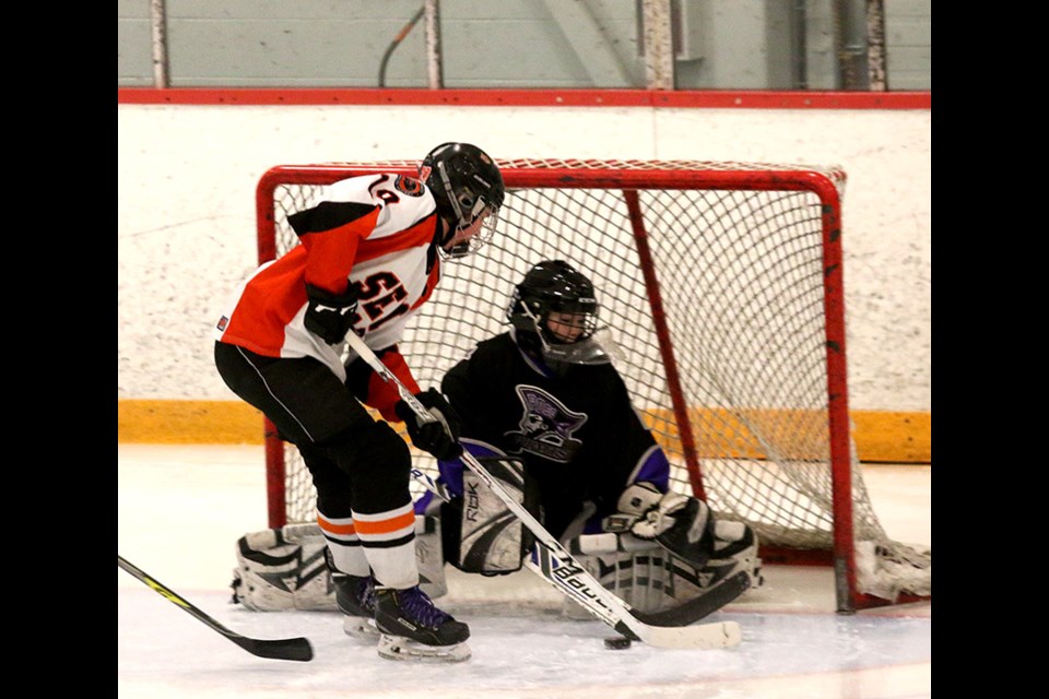 Port Coquitlam Pirates Bantam C1 goalie Aidan Grone makes a save on Semiahmoo C3 forward Samuel Snyder in the first period of their game at the PoCo Winter Classic hockey tournament, last Thursday at the PoCo Rec Complex.