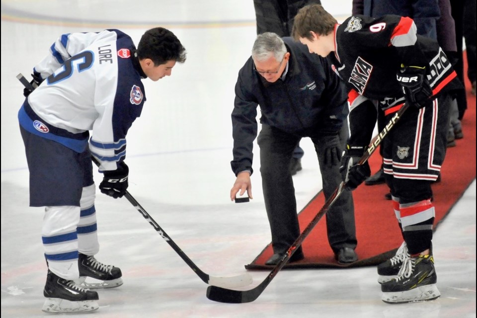 Councillor Bill McNulty drops the puck for the ceremonial face-off during Thursday night's opening ceremonies at the 38th annual Richmond International Bantam Midget Hockey Tournament. Action continues until the championship games on Monday.