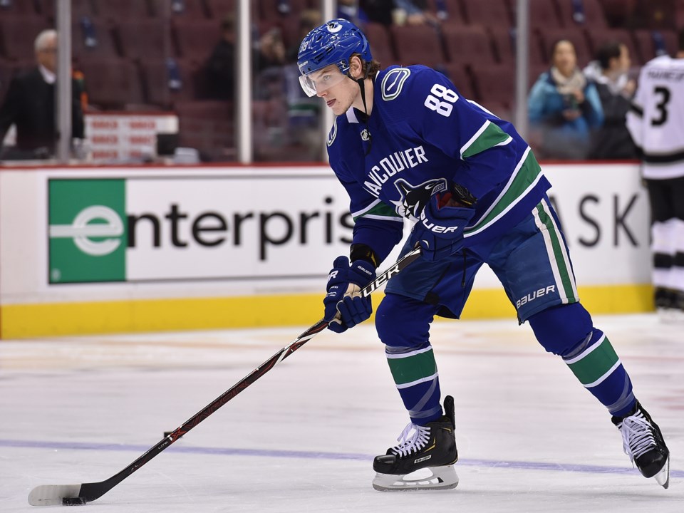 Adam Gaudette warms up with the Vancouver Canucks before a game with the Los Angeles Kings