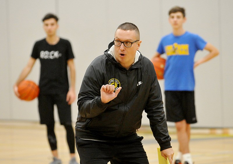 Gleneagle Talons senior boys basketball coach Jason Bingley conducts a recent practice.