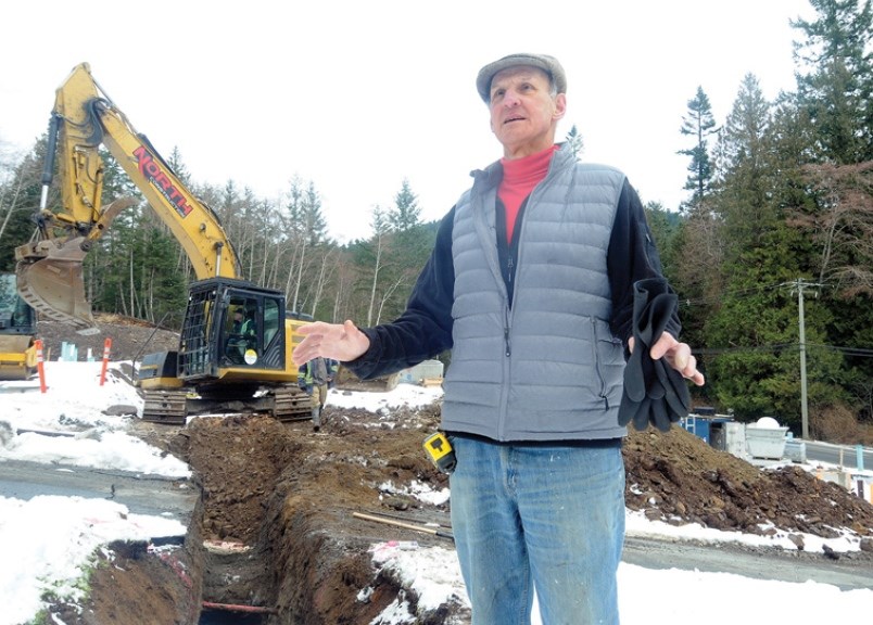 Snug Cove House board chair Graham Ritchie oversees progress at the site on Miller Road in March.
