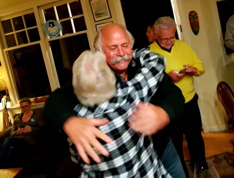 Mayor-elect Gary Ander hugs re-elected councillor Alison Morse after all the vote results come in.