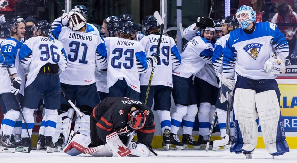 Mikey DiPietro collapses to the ice after losing to Finland at 2019 World Junior Championship.